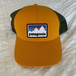 Patagonia logo yellow and green snap back LoPro trucker cap hat